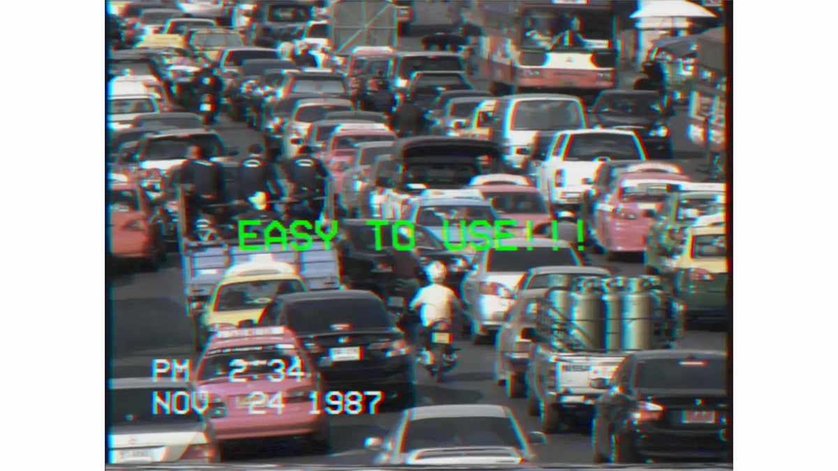 Date stamp over city traffic